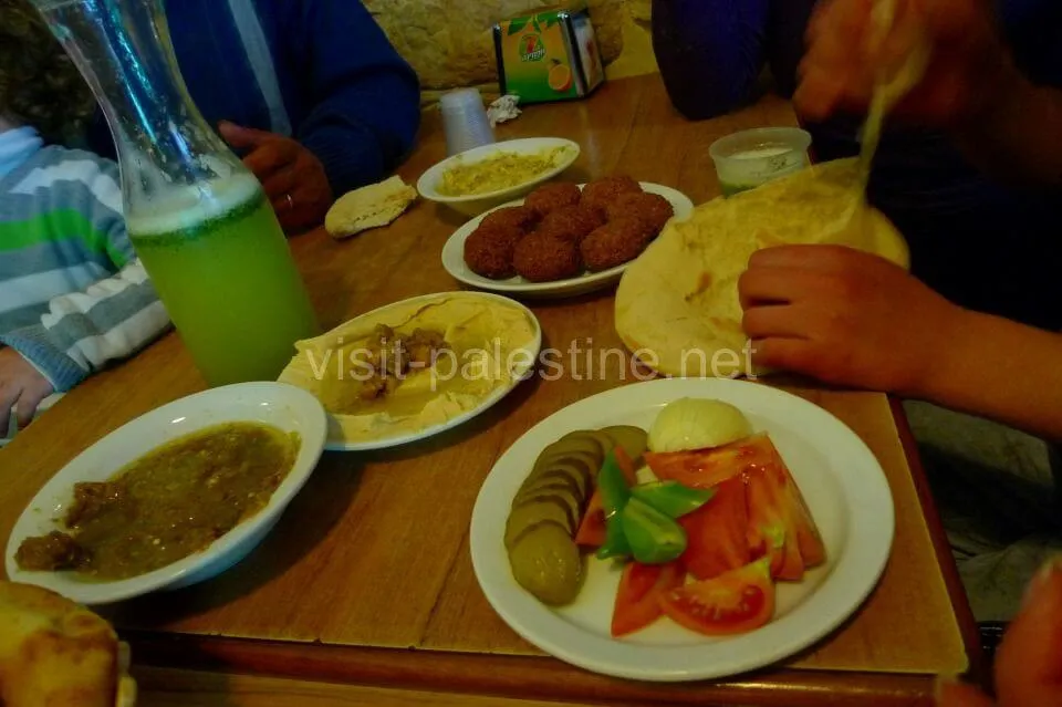 Palestinian falafel is made with mashed chickpeas and special spices. With hummus and bread, you could wish for anything more! Falafel restaurant Afteem table, Bethlehem