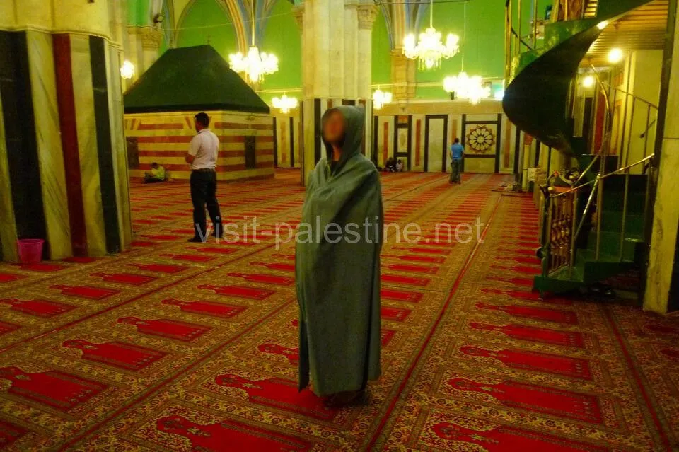 Women have to wear a robe inside the mosque. Robe for women in Abraham Mosque, Hebron