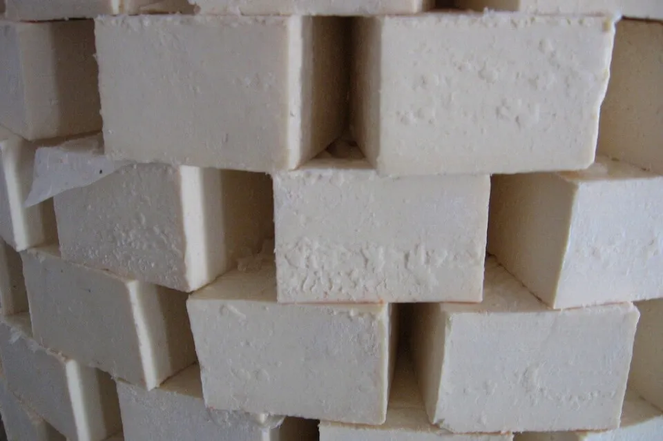 Soaps are piled up to dry after being cut. Kara Newhouse Olive oil soaps, Nablus